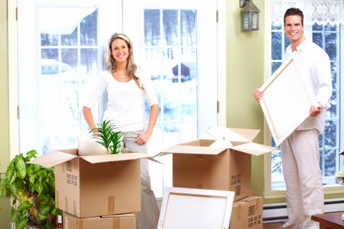 Professional movers handling furniture safely during house removals in Nunhead